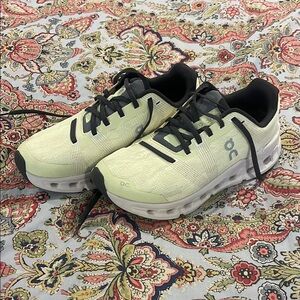 On Running Cream and Black Sneakers Sleek Design